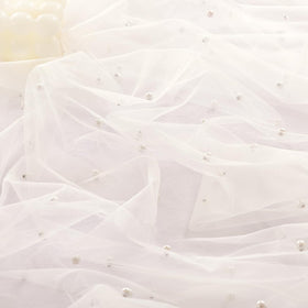 Socomi Pearl table runner on dining table with candles enhances ambiance