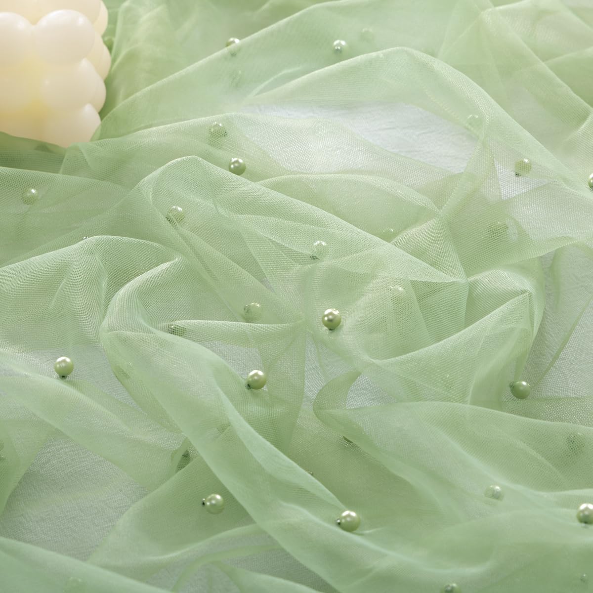 Socomi Pearl Table Runner sage green closeup showing soft gauze texture and breathable drape