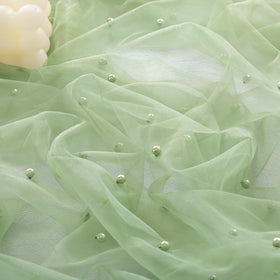 Socomi Pearl Table Runner sage green closeup showing soft gauze texture and breathable drape