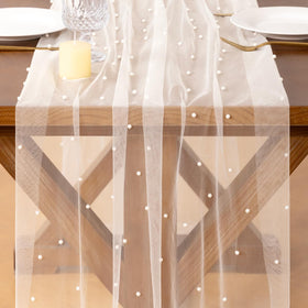 Socomi Pearl table runner draped on a wedding arch for romantic texture