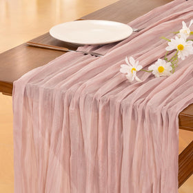 Socomi pink cheesecloth table runner on wedding table enhances romantic dining.