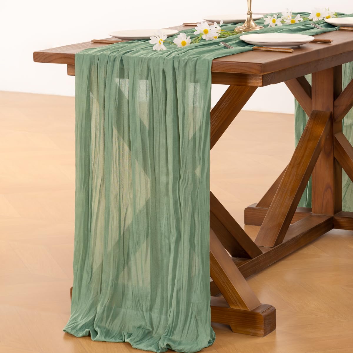 Socomi baby shower decor uses soft cheesecloth for intimate, elegant table styling.