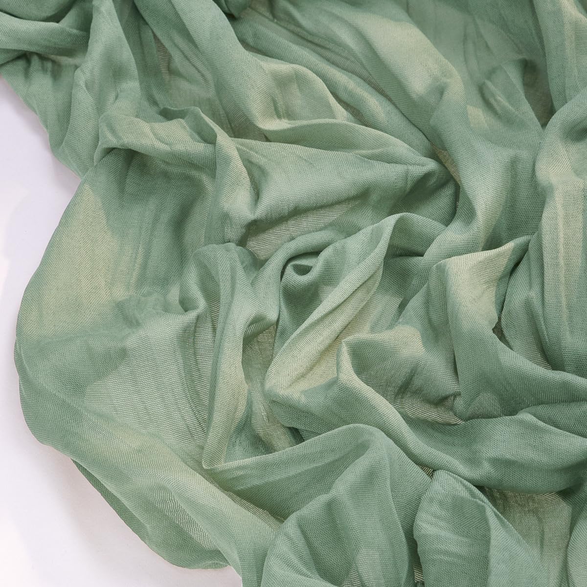 Socomi sage green runner edge-stitch detail improves durability and reduces fraying for formal setups.