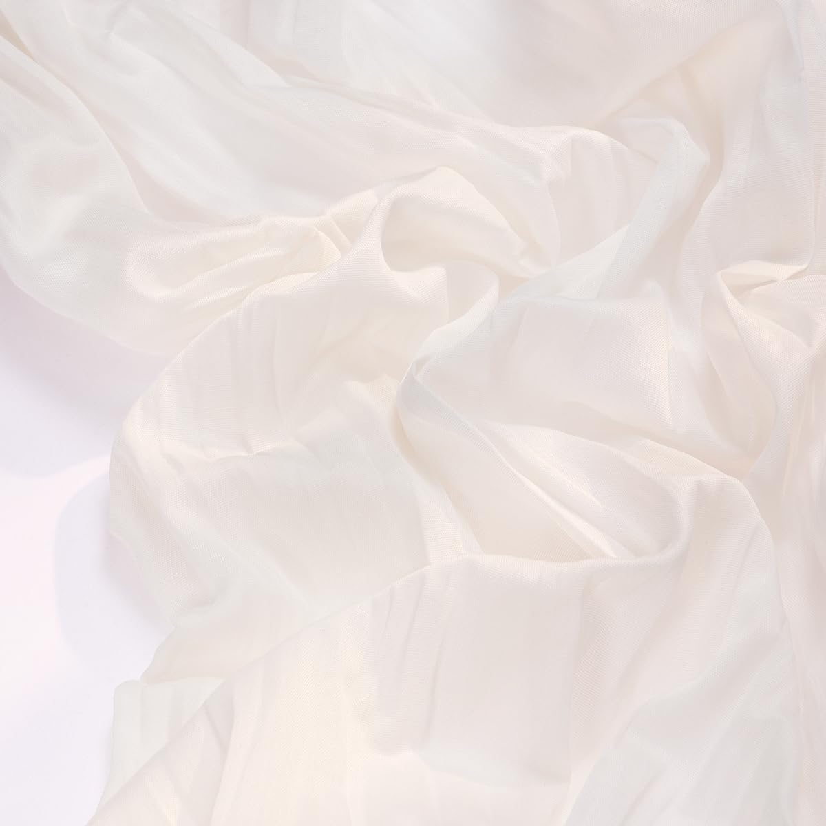 Socomi ivory cheesecloth runner on a wedding table for a soft gauze look.