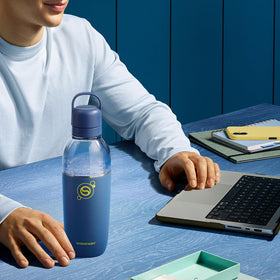 Close-up of the Storm cap on the Sodastream Fizz & Go bottle for leak-resistant beverage control.