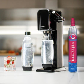 Sodastream setup in a modern kitchen with sparkling water glasses