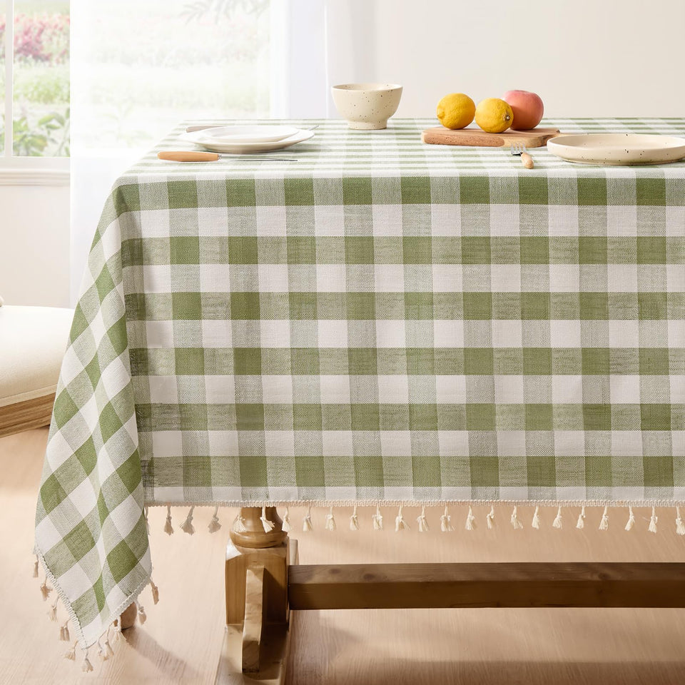 Softalker checkered tablecloth in sage enhances outdoor dining ambiance.