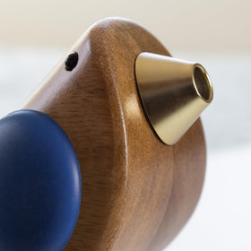SONGBIRD SPECIALTIES perches securely on a bottle for easy pouring.