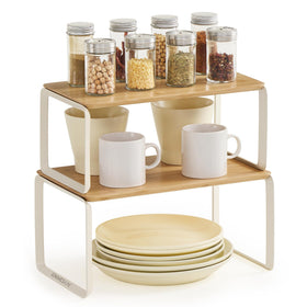 Songmics Home cabinet organizer shelf 2-pack on countertop keeping jars neatly displayed.