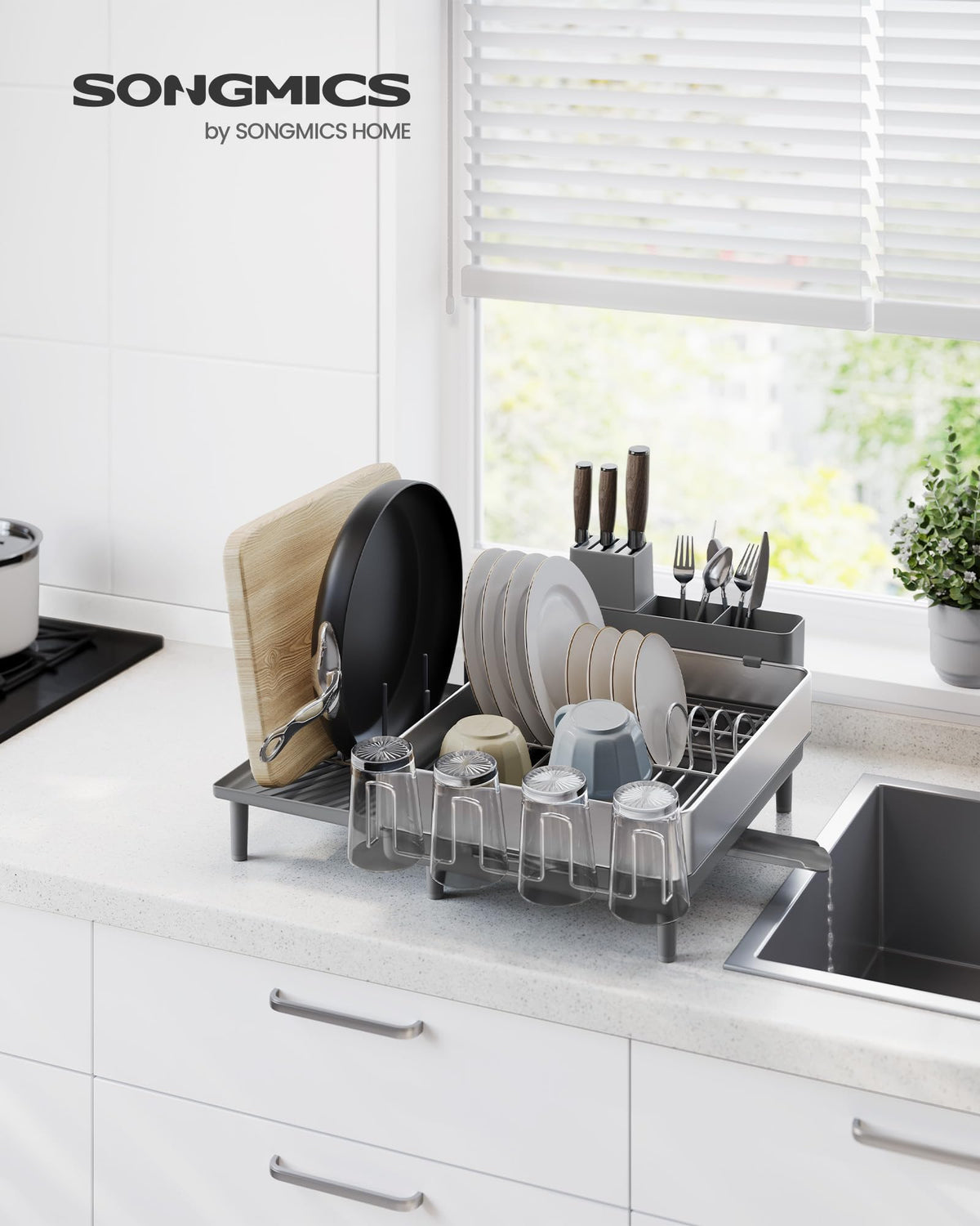 SONGMICS rack extended tray demonstrates extra space for pans and cutting boards.
