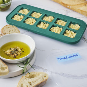 Souper Cubes freezer trays filled; convenient portioning for herbs, garlic, and pesto.