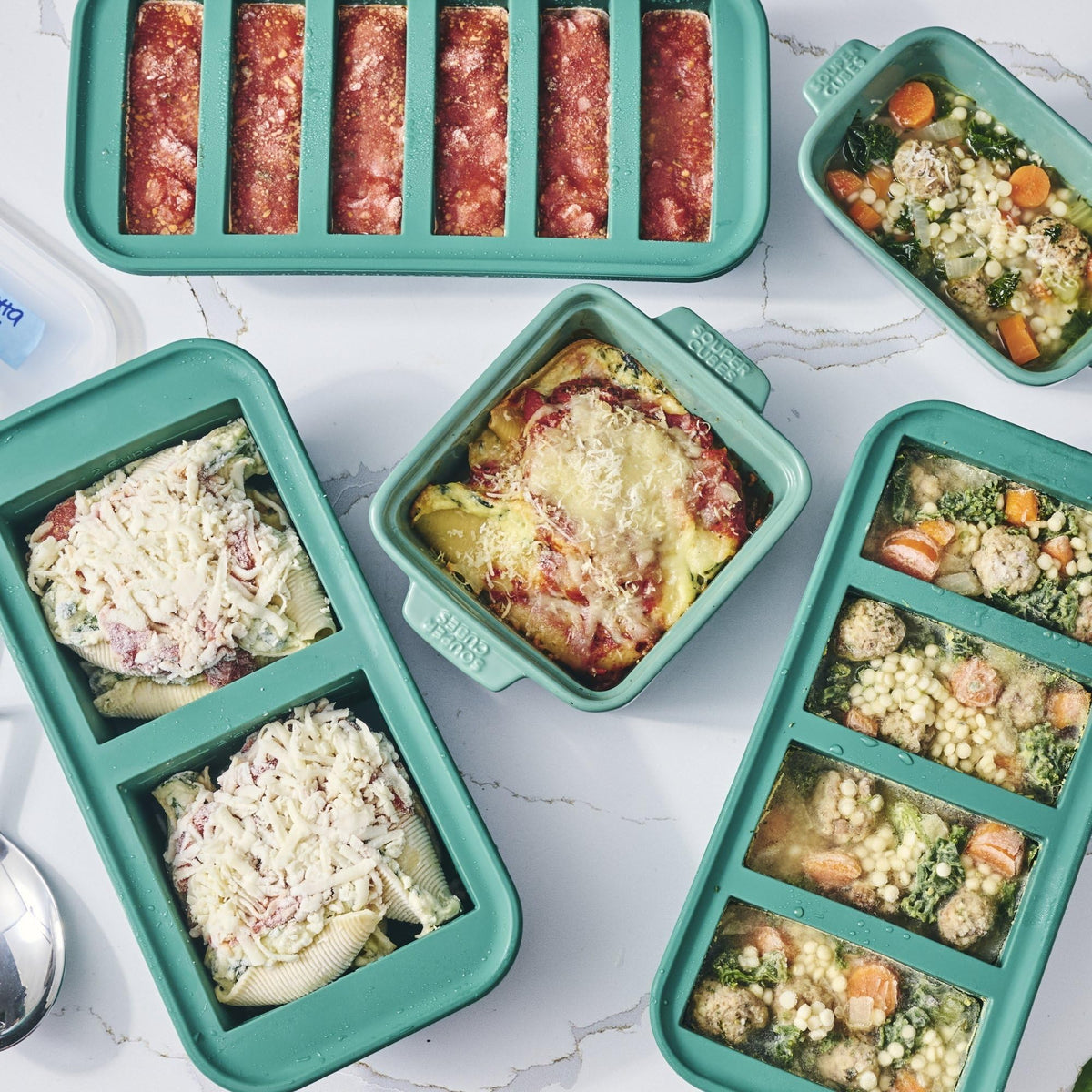 Souper Cubes kale color freezer trays in use for meal prep.