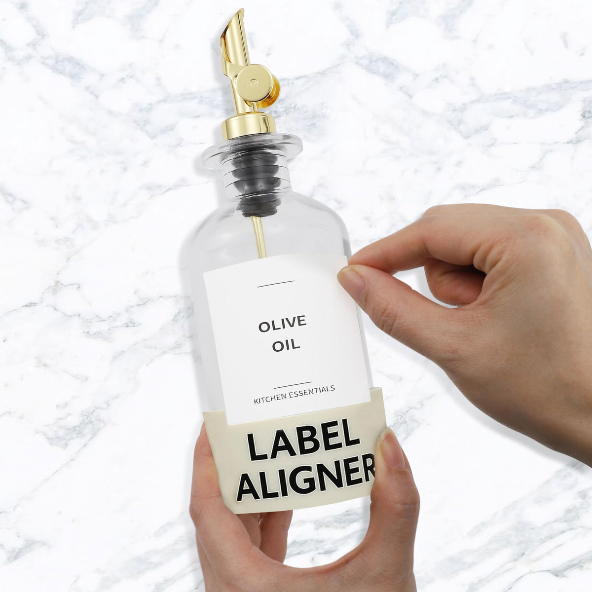 Label aligner tool paired with white labels for organized oils.