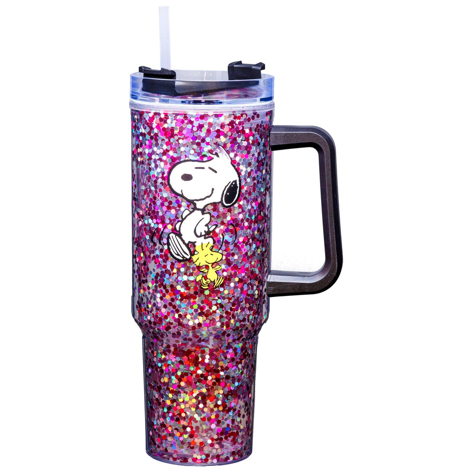 Spoontiques Peanuts 40oz glitter travel mug with sliding lid, keeps beverages hot or cold on the go.