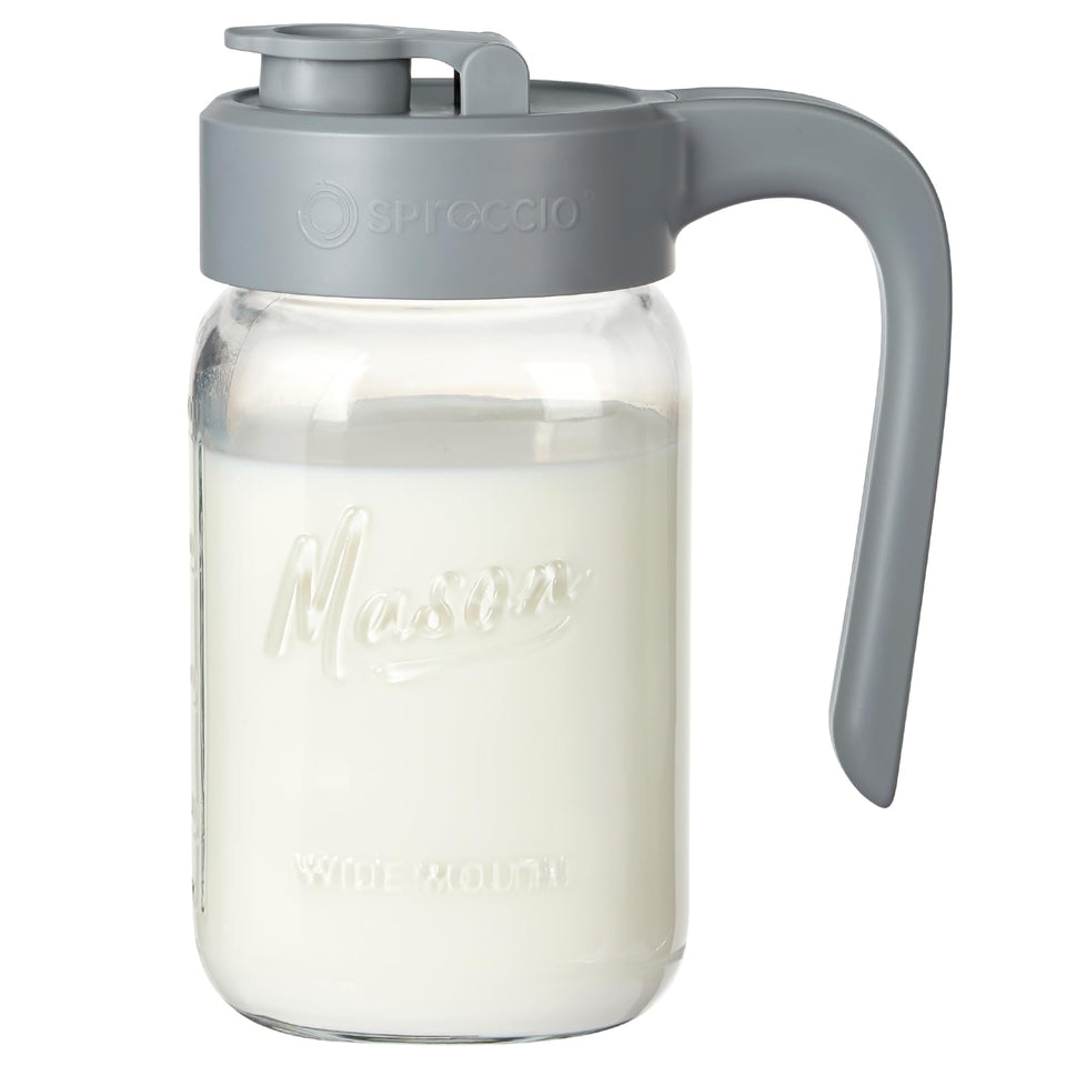 Spreccio 32 oz glass pitcher with lid for spill-free pours.