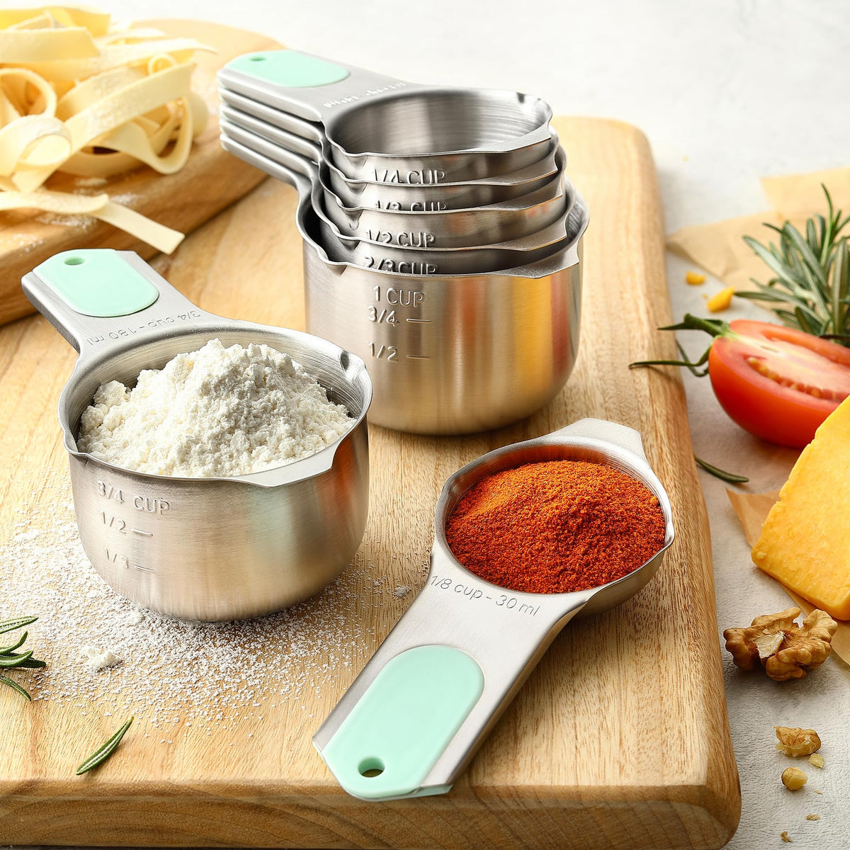 Spring Chef seven cups with clear volume marks from 1/8 to 1 cup.