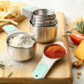 Spring Chef seven cups with clear volume marks from 1/8 to 1 cup.