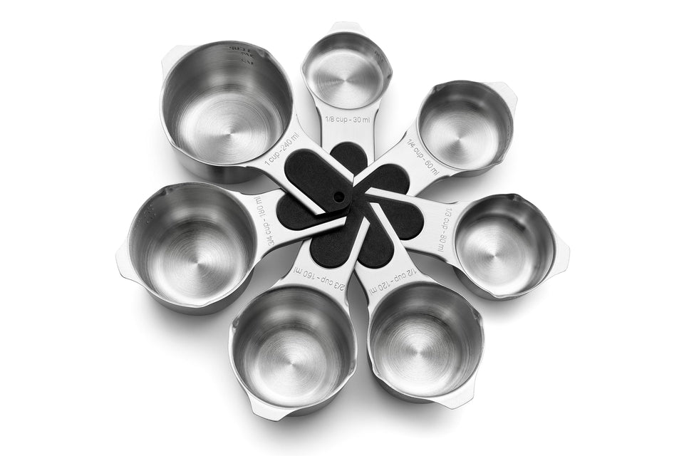 Spring Chef magnetic measuring cups nest for compact storage and quick access.