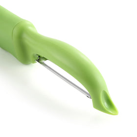 Spring Chef peeler in action peeling apple and carrot with smooth glide.