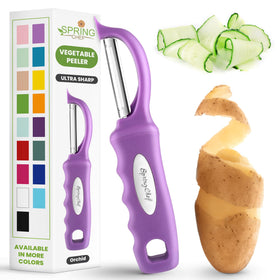 Spring Chef Premium Swivel Peeler held in hand for easy peeling