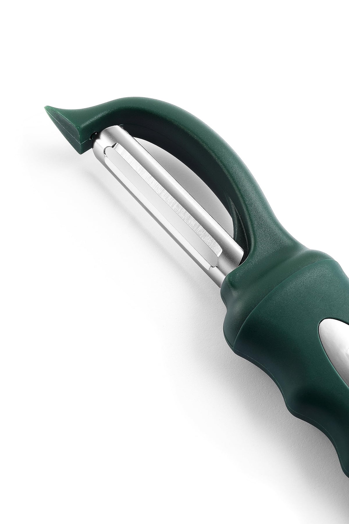 Spring Chef vegetable peeler with peeled skins neatly stacked