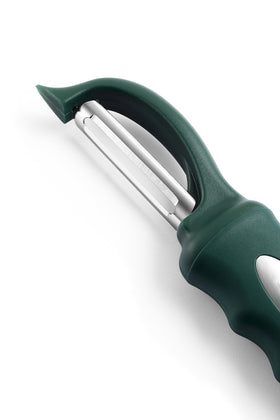 Spring Chef vegetable peeler with peeled skins neatly stacked
