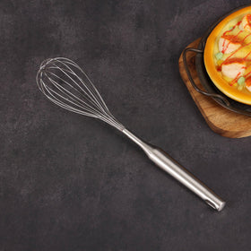 Standcn pasta server helps lift and portion spaghetti neatly.