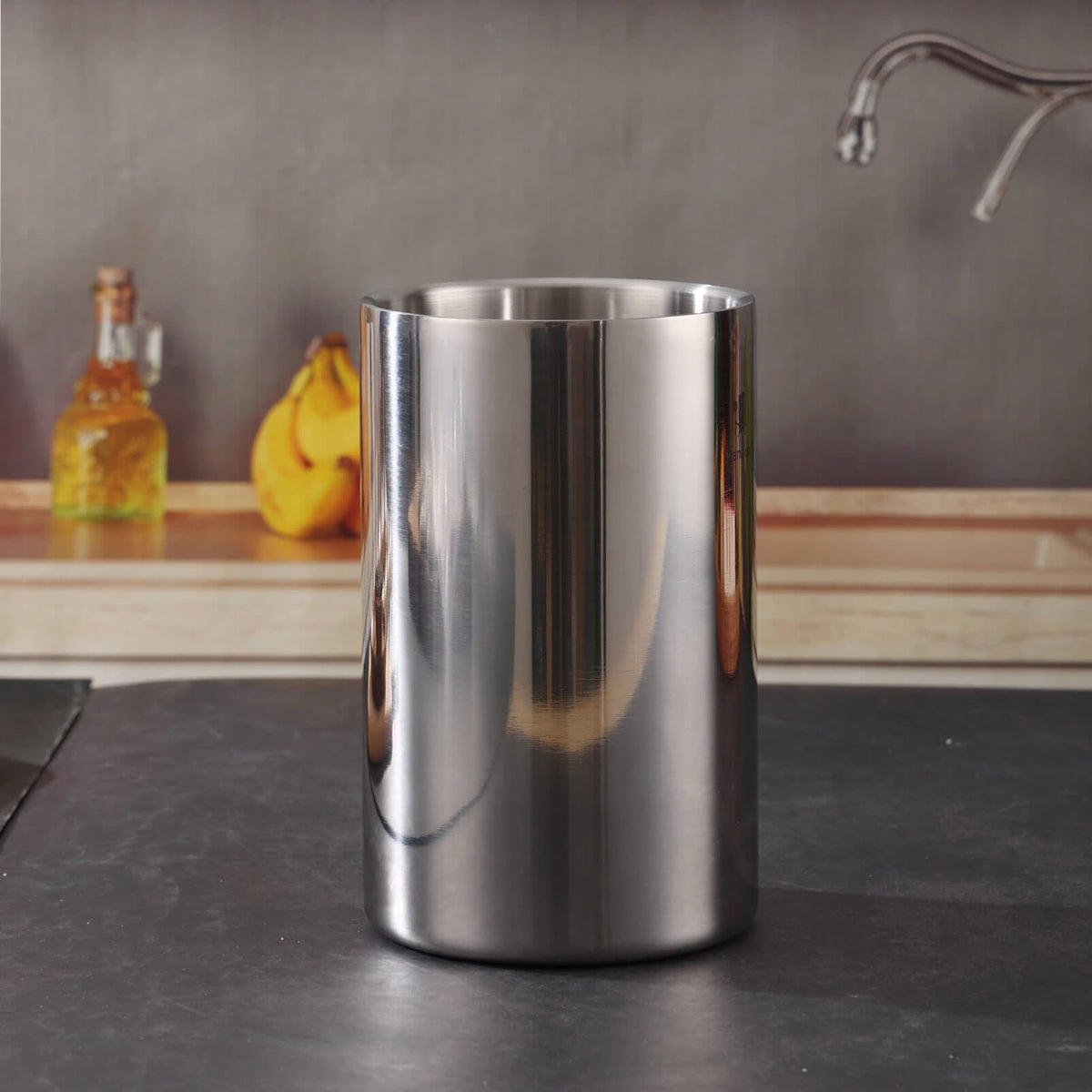Standcn double wall utensil holder with utensils demonstrates upright organization for quick access