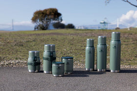 STANLEY Adventure-To-Go bottle with leakproof cup lid for mess-free sipping outdoors.