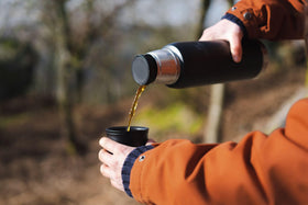Stanley Adventure-To-Go bottle with leakproof cup lid for mess-free travel.