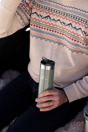 Stanley AeroLight Transit Bottle held in hand demonstrates compact, commuter-friendly size and portability.