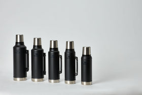 Stanley Classic Vacuum Bottle with collapsible handle for easy transport.