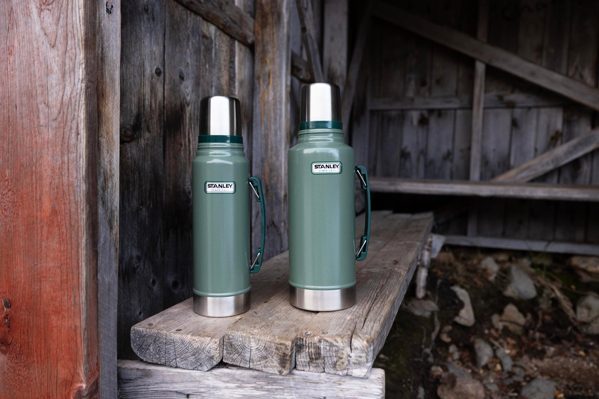 STANLEY Heritage Classic bottle shown on camping trip illustrating insulation.