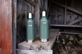 STANLEY Heritage Classic bottle shown on camping trip illustrating insulation.