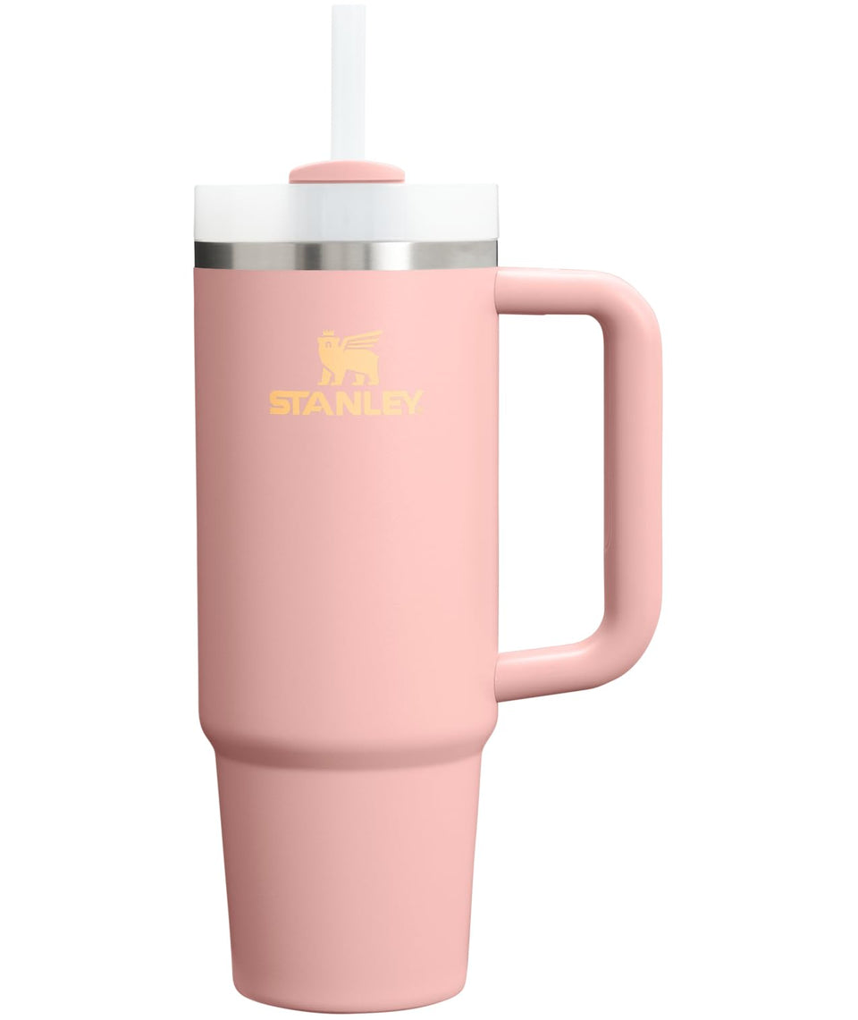 Stanley Quencher H2O tumbler with handle and straw in Peach Rose keeps drinks cold.