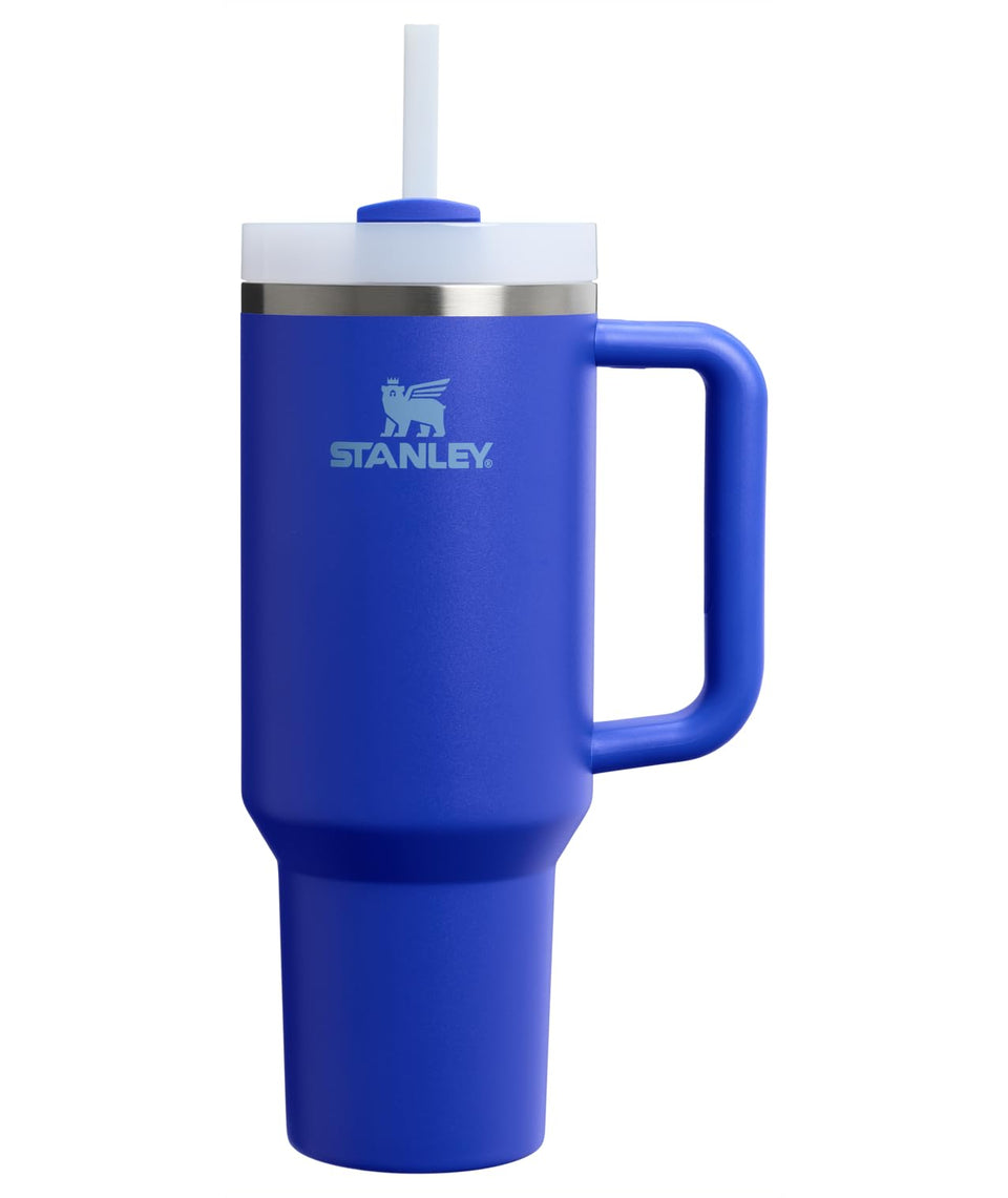 Stanley Quencher H2.0 tumbler with handle and straw keeps drinks cold and portable.