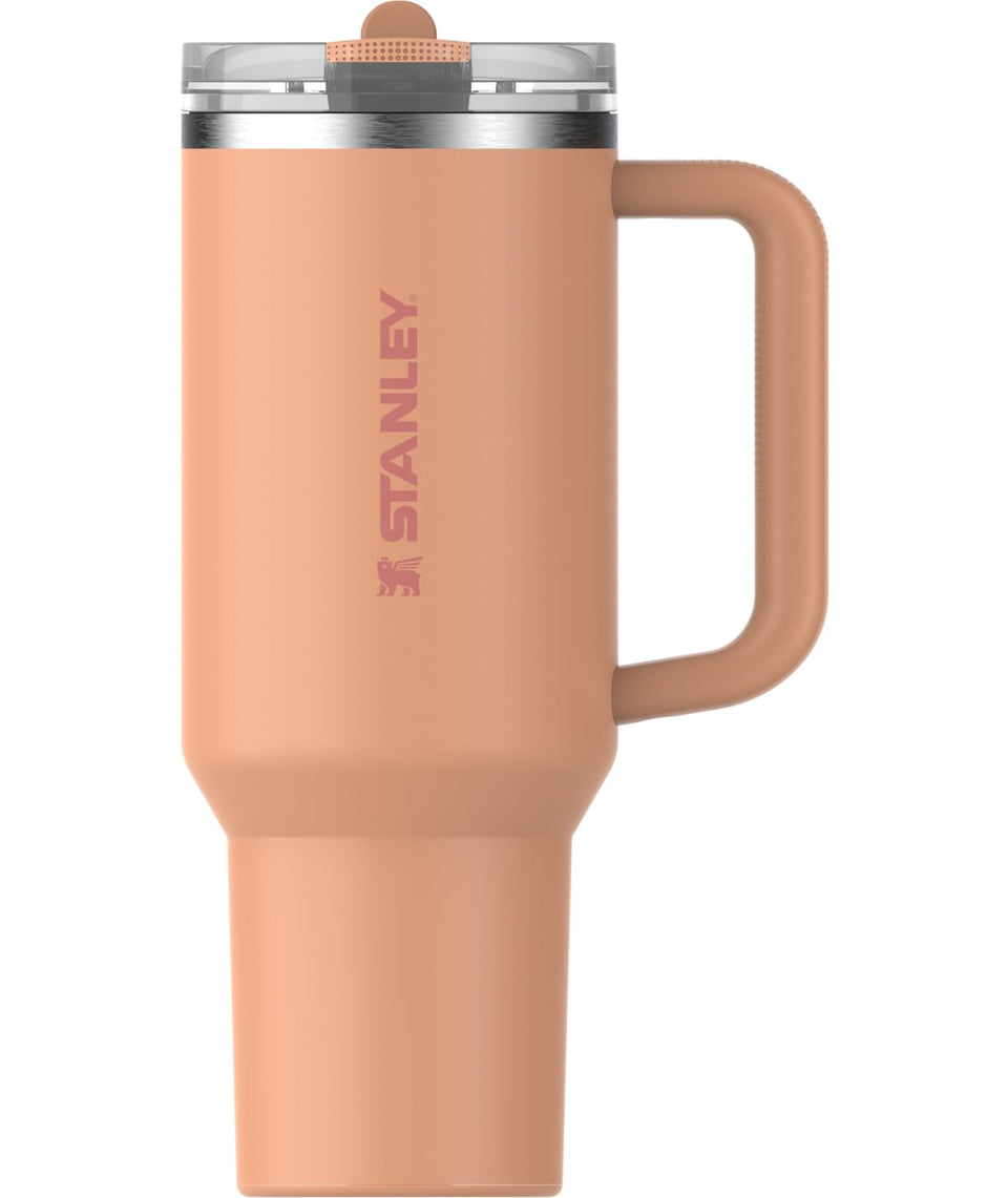 Stanley Quencher ProTour 40oz apricot bottle with built-in straw for easy on-the-go hydration.