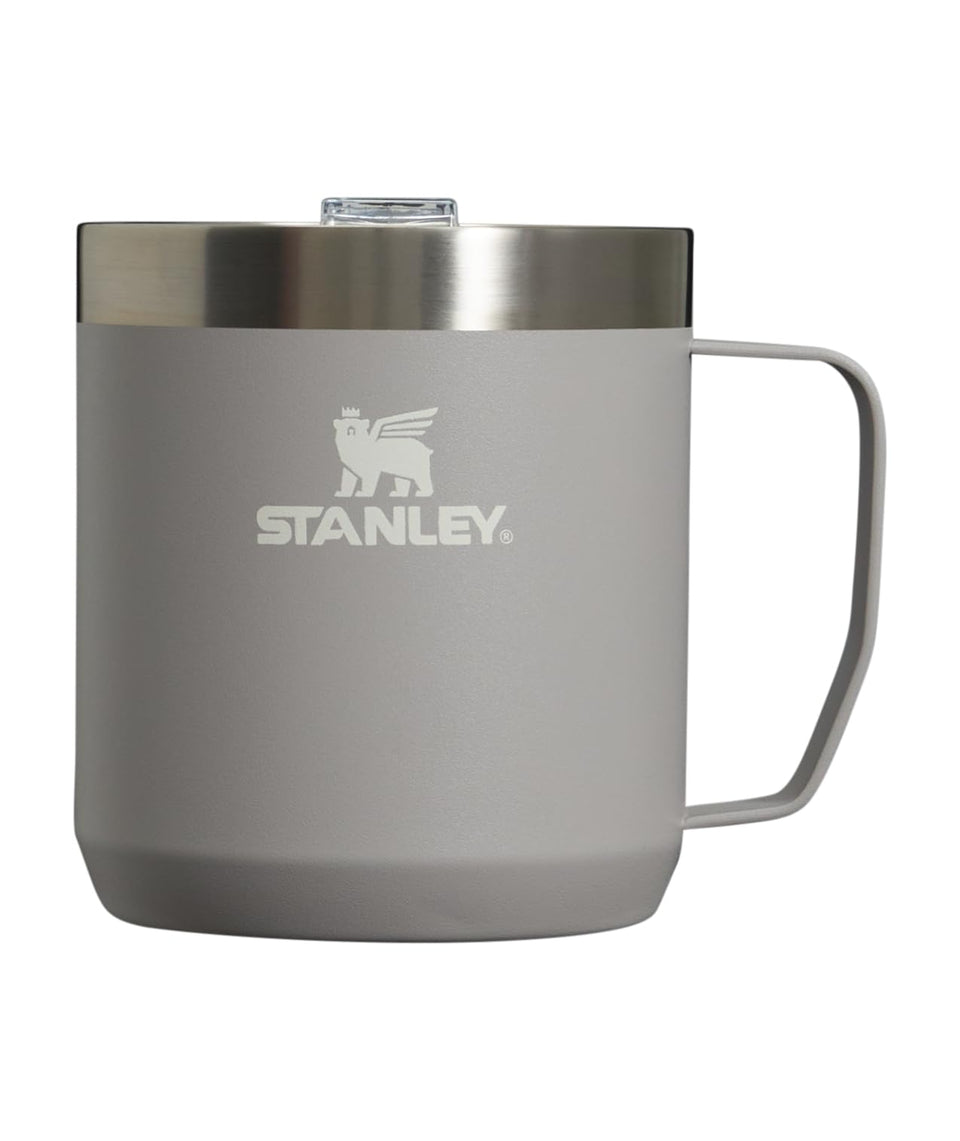 STANLEY Stay-Hot Camp Mug 12 oz on a sunlit patio, ideal for relaxed mornings.
