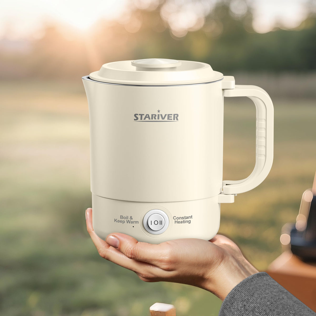 Stariver portable travel kettle with foldable handle for compact packing and travel.