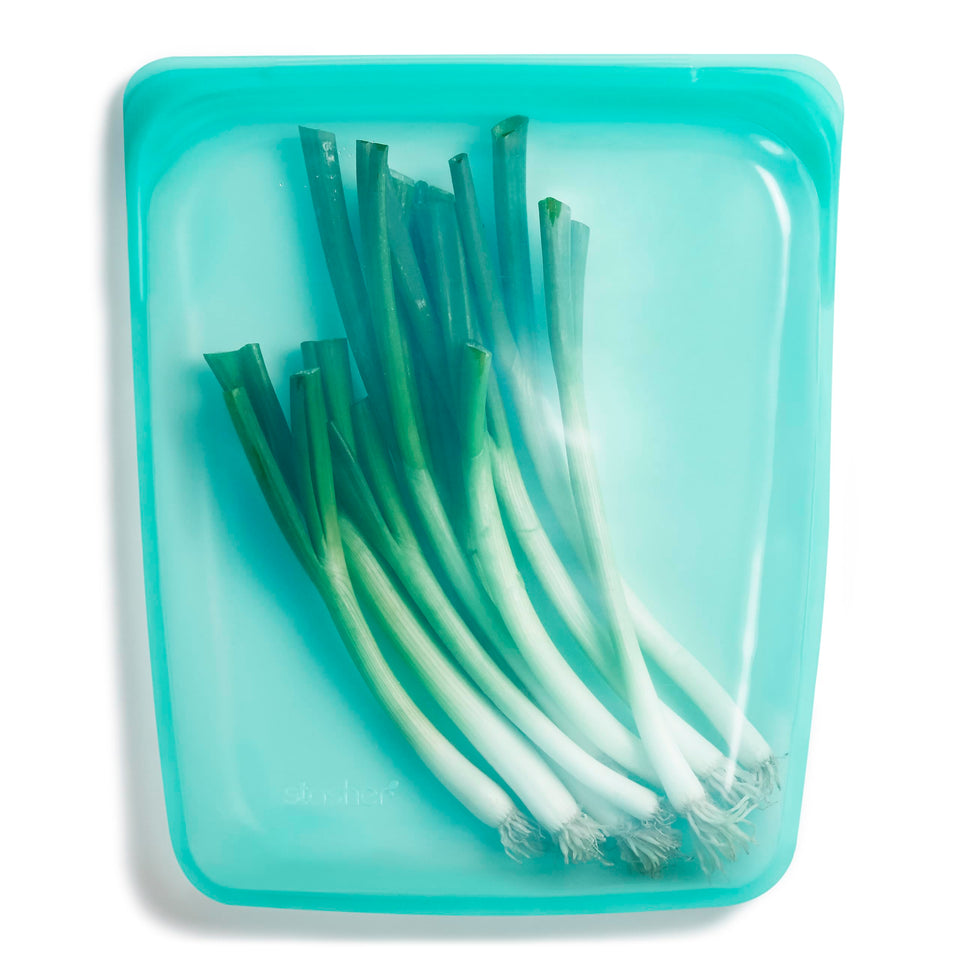Stasher half gallon bag in aqua, leakproof and reusable for meal prep.