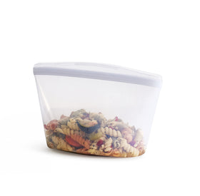 Stasher silicone reusable storage bag shows clear design for spill-free meal prep.