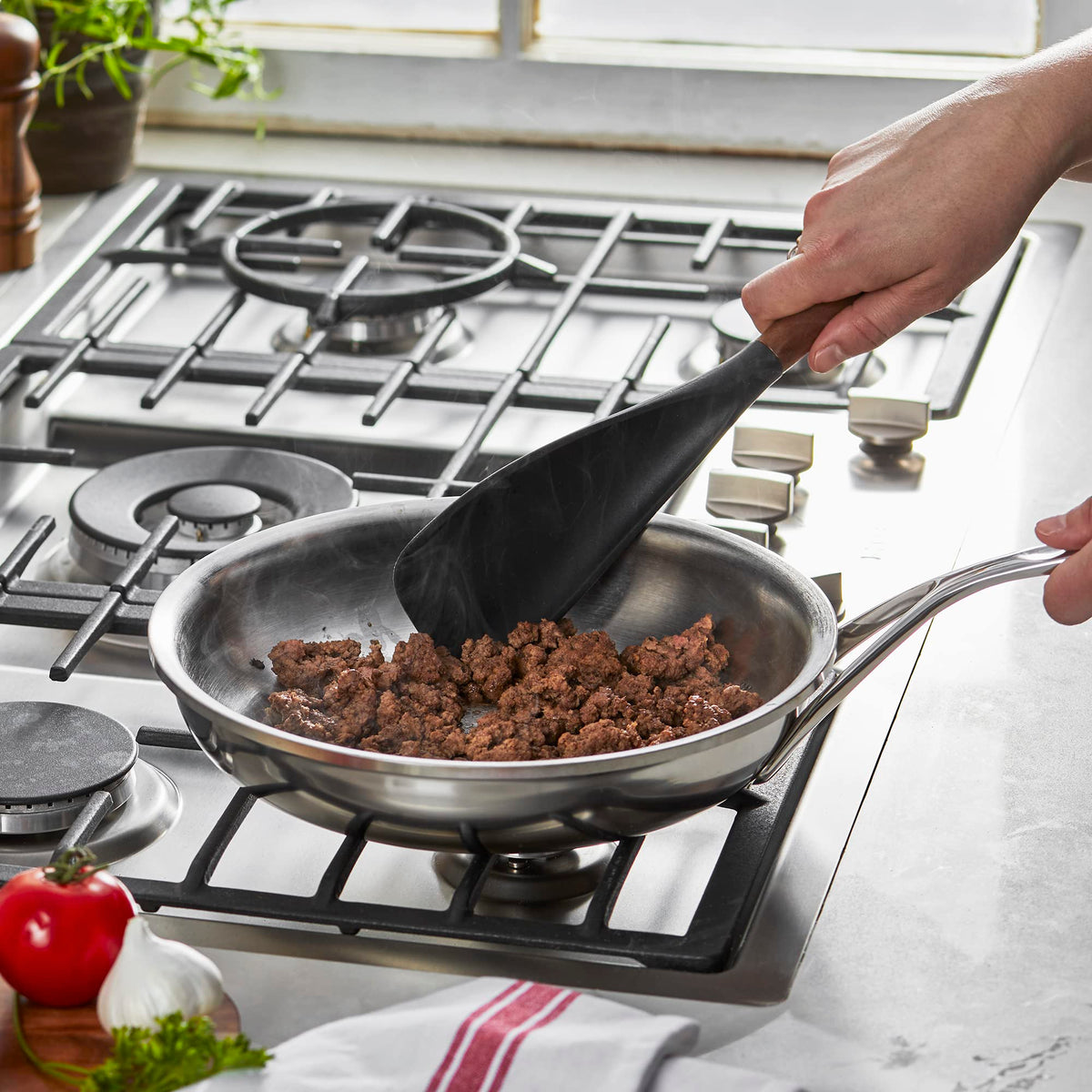 STAUB spatula spoon with Acacia wood handle for ergonomic grip and stylish serving.