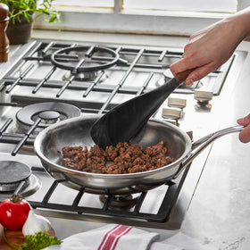 STAUB spatula spoon with Acacia wood handle for ergonomic grip and stylish serving.