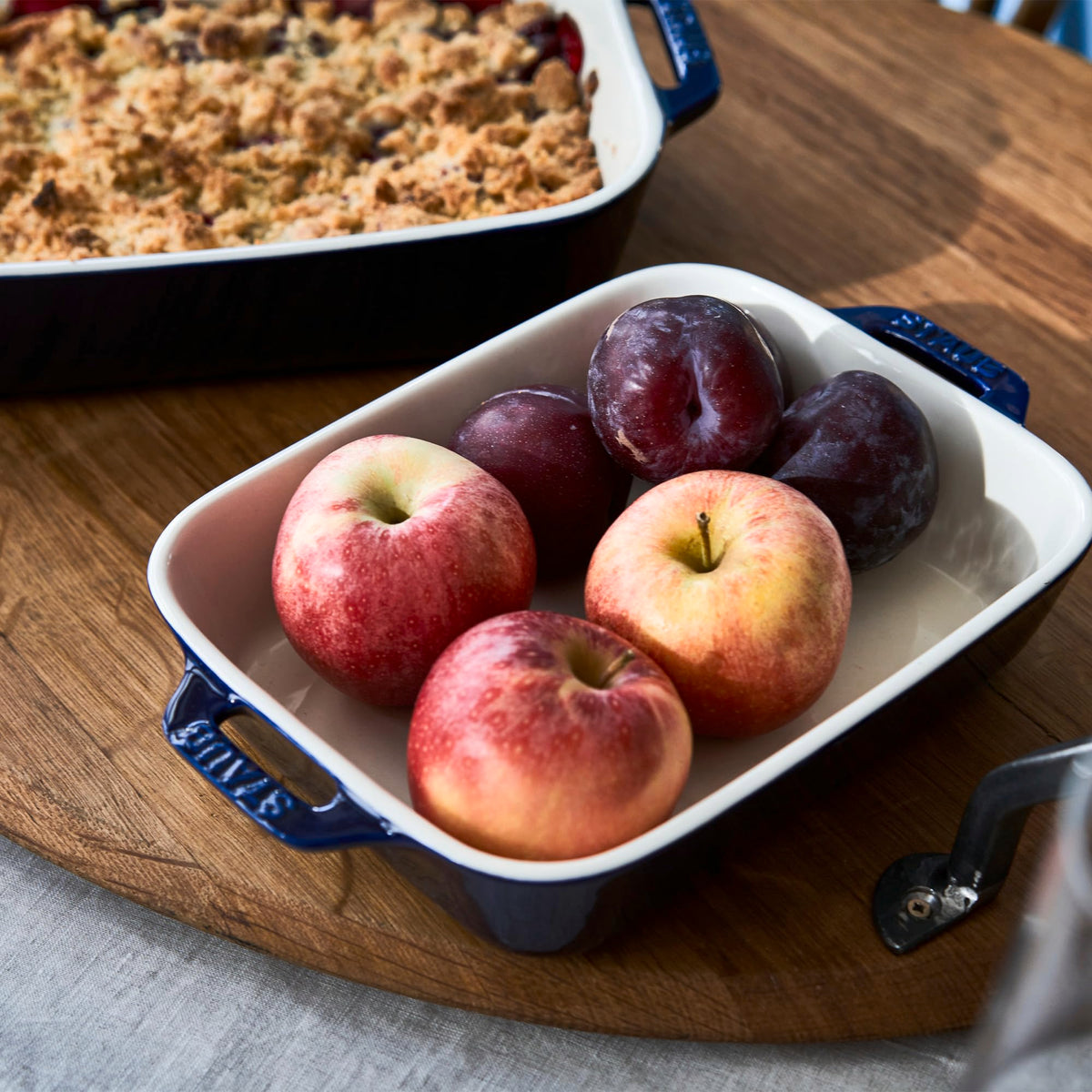 Staub 10.5x7.5 inch dish retains heat for steady, shareable portions.
