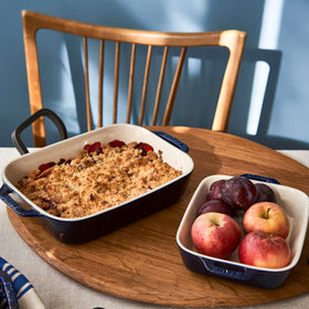 Dark blue Staub baking dish displayed for elegant oven-to-table presentation.