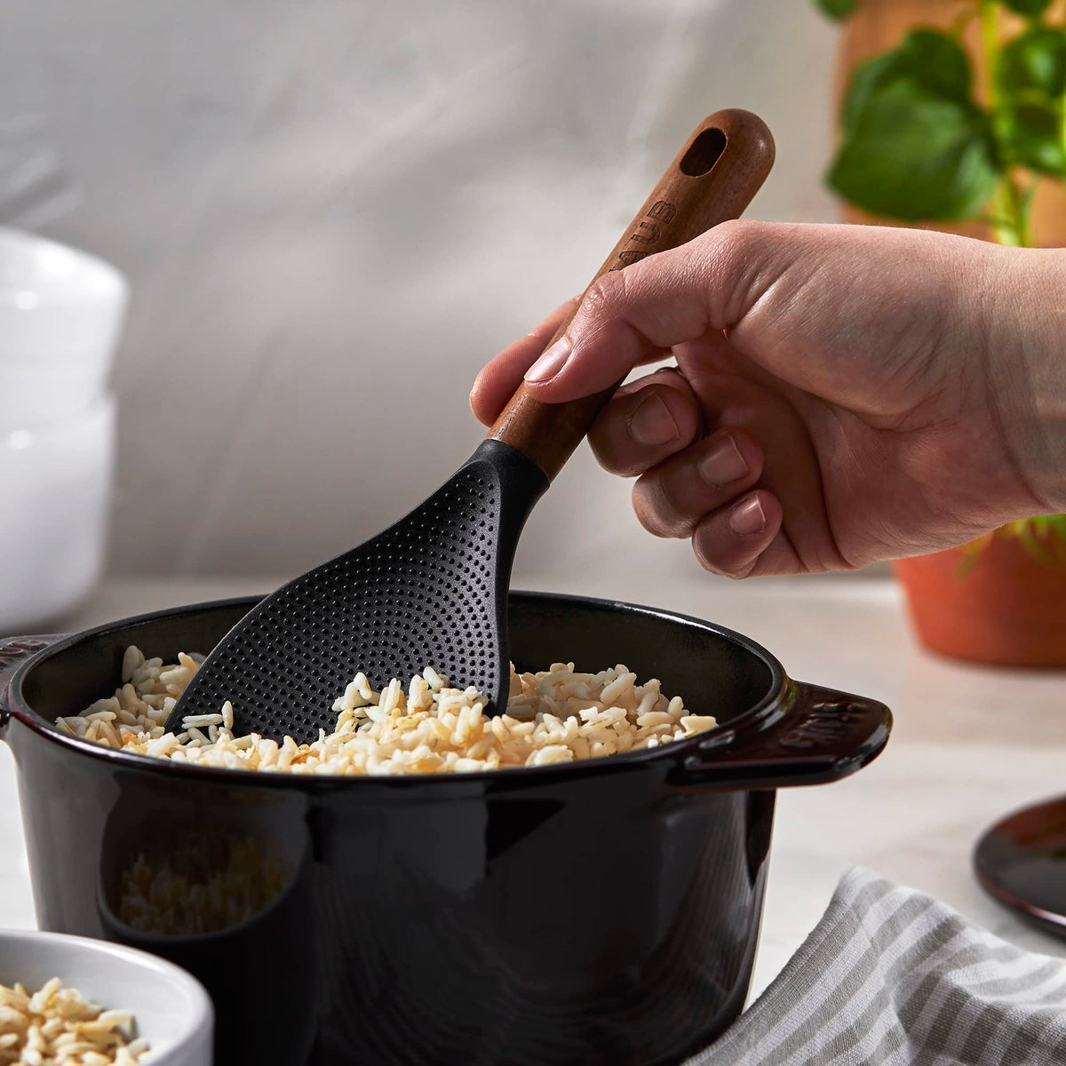 STAUB rice spoon featuring acacia wood handle for ergonomic grip