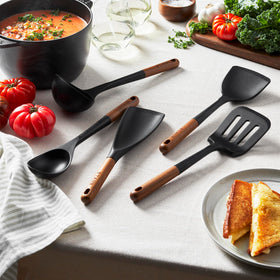 STAUB wok turner designed for flipping and scraping in high-heat pans.