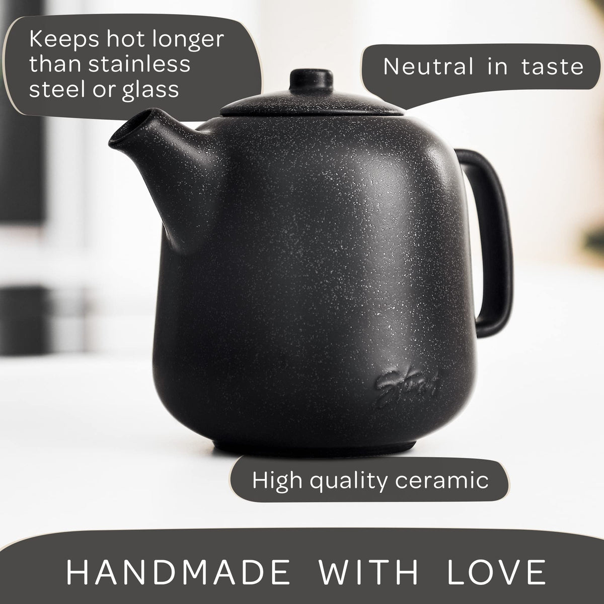 Steinzeit ceramic black teapot featuring a unique reactive glaze pattern