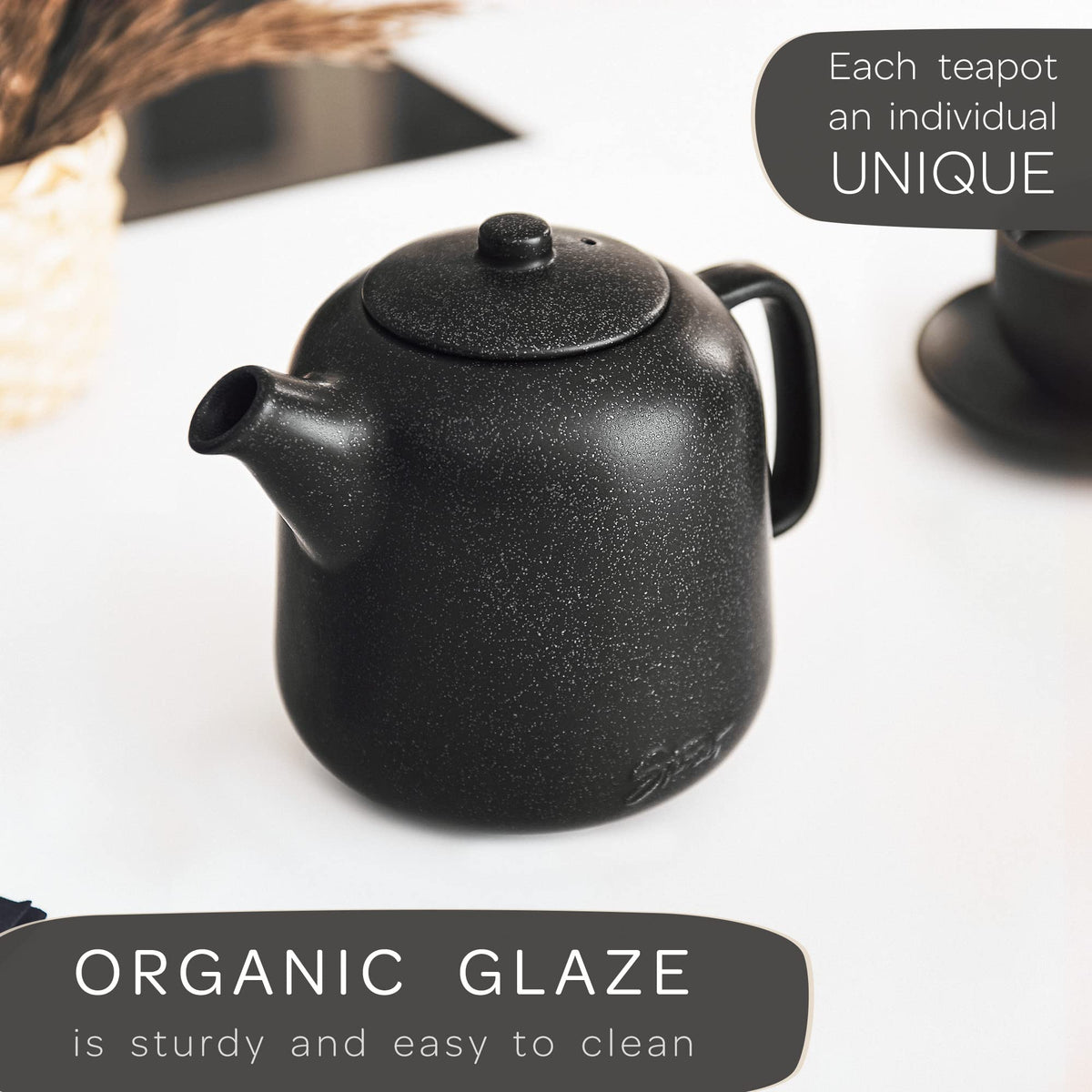 Steinzeit teapot displays matte black reactive glaze design