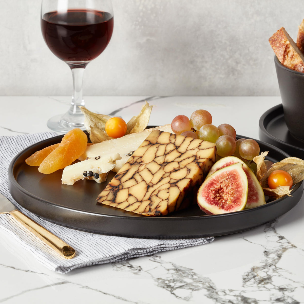 Celina matte black glaze enhances contemporary tabletop appeal.